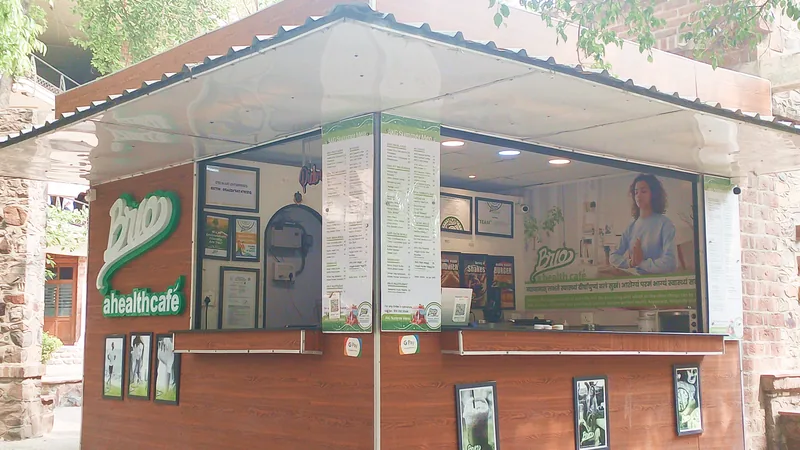 The BRIO kiosk at AKGEC beside a brick building