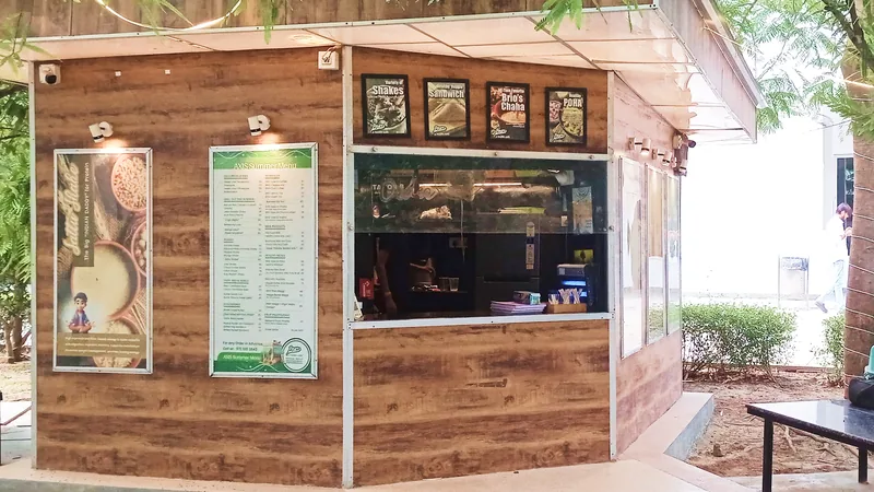 The BRIO kiosk at AXIS Institute under a leafy tree